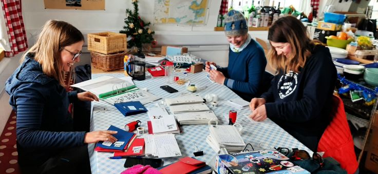 The team stamps and cancels the mail