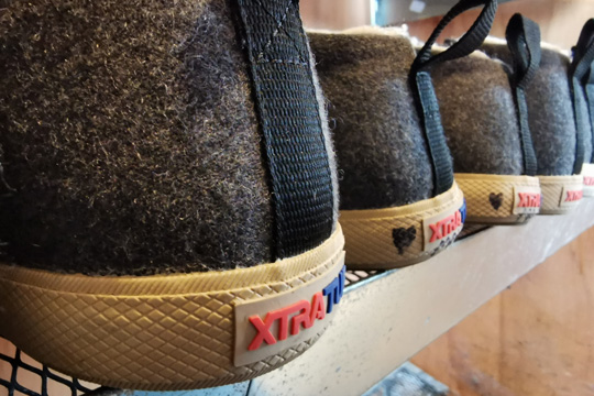 XtraTuf boots on a shelf