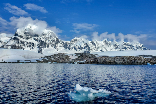 Clouds roll over the mountains opposite Port Lockroy