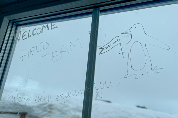 A welcome message written on the window