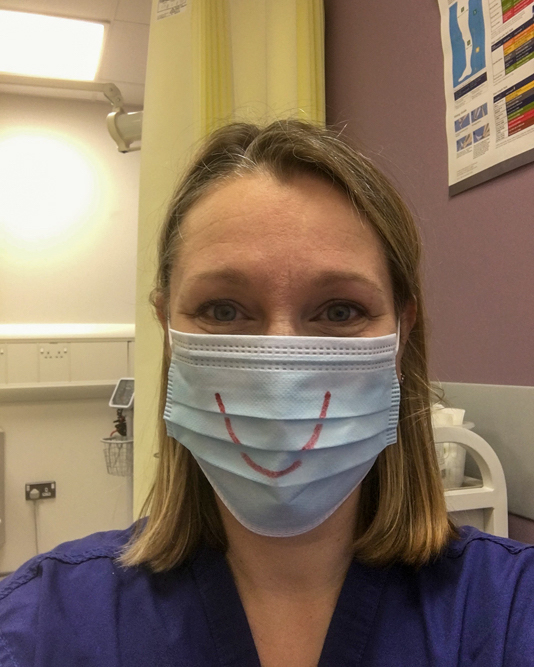 Heather in a face mask in a hospital