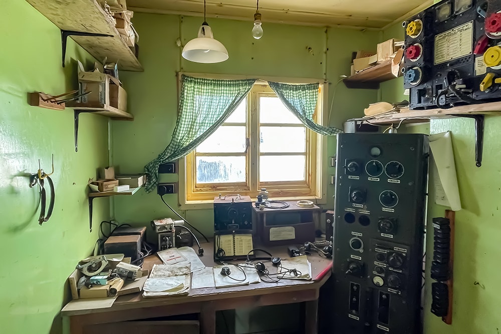 Inside the radio room showings its green walls and old radio