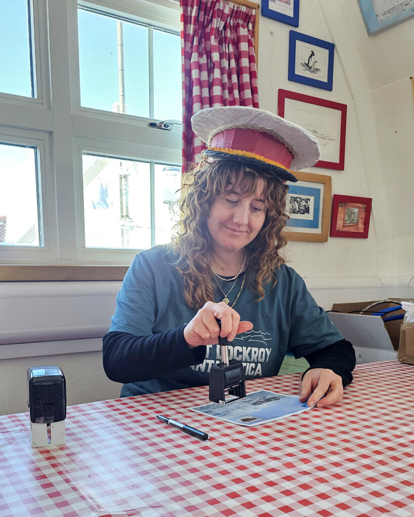 Rachel stamping mail