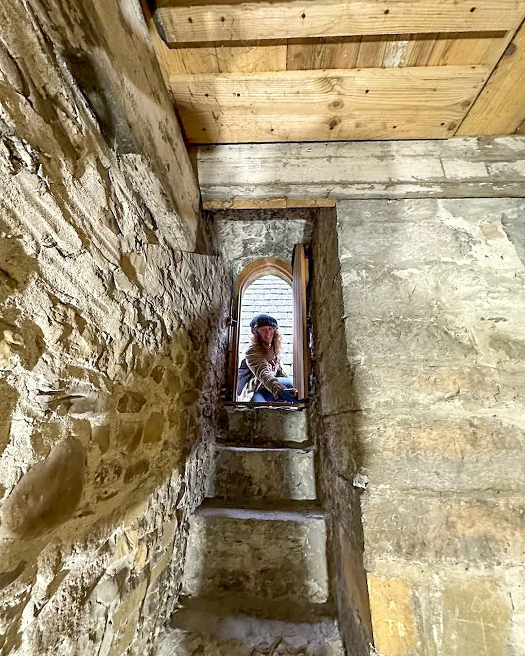 Conservation carpenter Kate working on a historic building